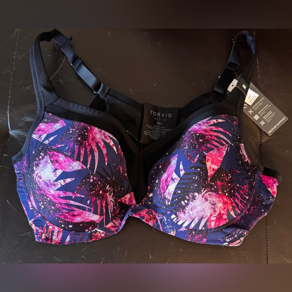 Torrid Pink and Black Sports Bra with Bold Tropical Design